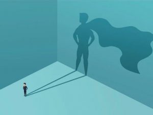 Illustration of person standing with a shadow that has a hero cape