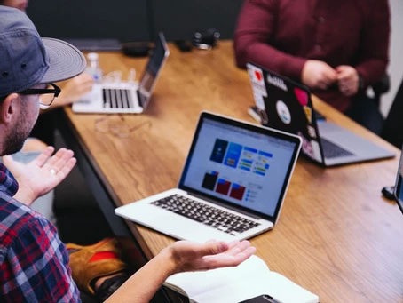 Group meeting with their laptops